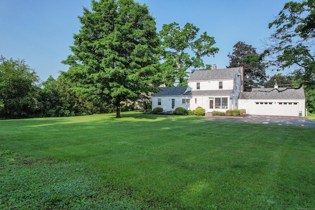 22 Spring Rd, North Haven, CT 06473 - view of green lawn with a garage and driveway