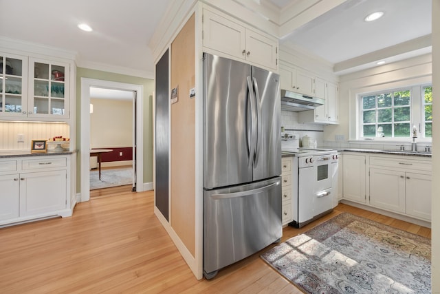 22 Spring Rd, North Haven, CT 06473 - kitchen featuring freestanding refrigerator, white range with electric cooktop, ornamental molding, under cabinet range hood, and decorative backsplash