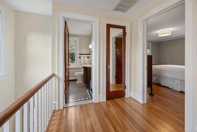 22 Spring Rd, North Haven, CT 06473 - hall featuring light wood-type flooring and an upstairs landing