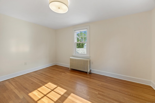 22 Spring Rd, North Haven, CT 06473 - empty room featuring radiator and light wood-style floors
