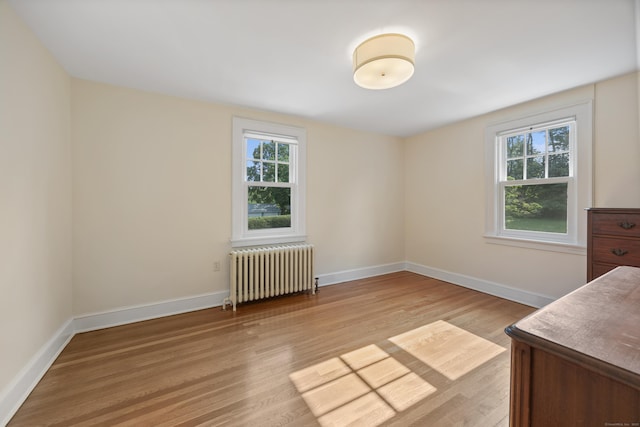 22 Spring Rd, North Haven, CT 06473 - unfurnished bedroom with radiator and light wood finished floors