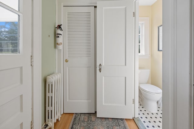 22 Spring Rd, North Haven, CT 06473 - bathroom with radiator and wood finished floors