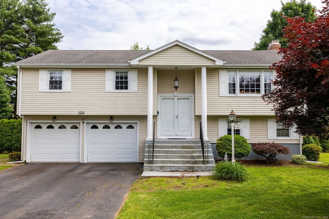 100 Chestnut Rd, Newington, CT 06111 - split foyer home featuring asphalt driveway, a garage, a front yard, and a shingled roof
