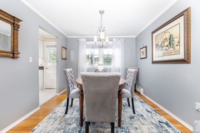 100 Chestnut Rd, Newington, CT 06111 - dining area with baseboard heating, a chandelier, light wood-style floors, and ornamental molding