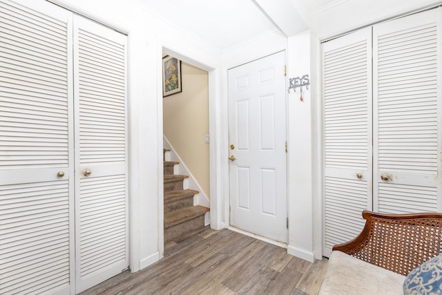 100 Chestnut Rd, Newington, CT 06111 - foyer entrance featuring light wood finished floors, ornamental molding, and stairway