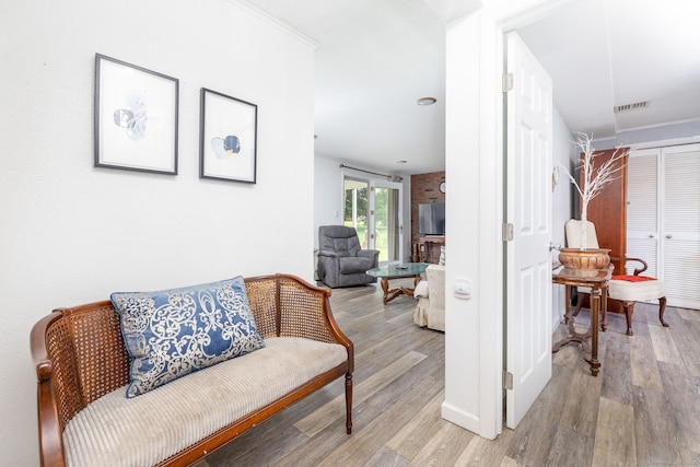 100 Chestnut Rd, Newington, CT 06111 - hallway with light wood-style flooring and crown molding