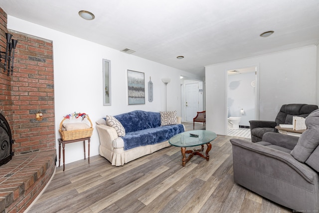 100 Chestnut Rd, Newington, CT 06111 - living room with a wood stove and wood finished floors