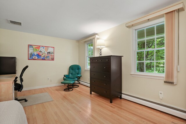 14 Inverness Rd, Trumbull, CT 06611 - home office featuring baseboard heating, wood finished floors, and healthy amount of natural light