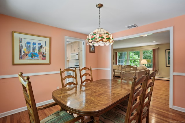 14 Inverness Rd, Trumbull, CT 06611 - dining room with wood finished floors and a baseboard radiator