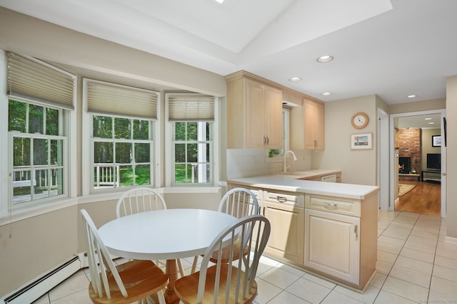14 Inverness Rd, Trumbull, CT 06611 - kitchen with light brown cabinetry, baseboard heating, light countertops, light tile patterned floors, and a peninsula