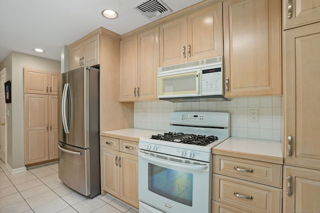 14 Inverness Rd, Trumbull, CT 06611 - kitchen with white appliances, light brown cabinets, light countertops, light tile patterned flooring, and backsplash