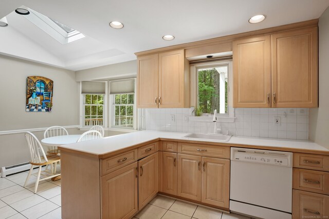 14 Inverness Rd, Trumbull, CT 06611 - kitchen featuring white dishwasher, a skylight, light countertops, a baseboard heating unit, and light tile patterned floors