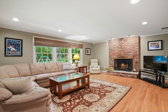 14 Inverness Rd, Trumbull, CT 06611 - living area featuring crown molding, wood finished floors, a brick fireplace, recessed lighting, and baseboard heating