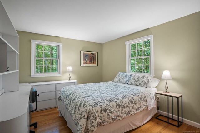 14 Inverness Rd, Trumbull, CT 06611 - bedroom with wood finished floors and multiple windows