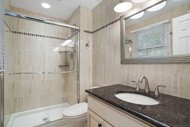14 Inverness Rd, Trumbull, CT 06611 - bathroom with vanity, a stall shower, and tile walls