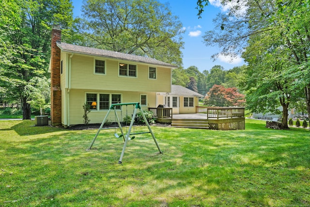 14 Inverness Rd, Trumbull, CT 06611 - rear view of property featuring a chimney, a wooden deck, a playground, and a lawn