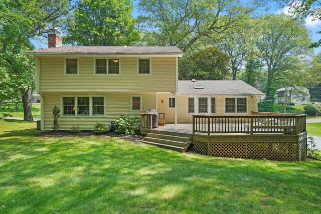 14 Inverness Rd, Trumbull, CT 06611 - rear view of house with a chimney, a lawn, and a wooden deck