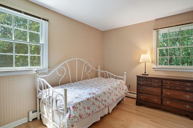 14 Inverness Rd, Trumbull, CT 06611 - bedroom with wallpapered walls, a baseboard radiator, light wood-style flooring, and baseboard heating