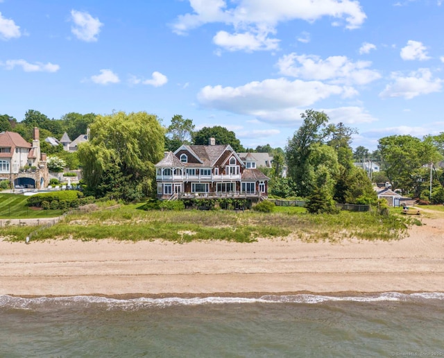 1410 S Pine Creek Rd, Fairfield, CT 06824 - back of property featuring view of water and beach and a chimney