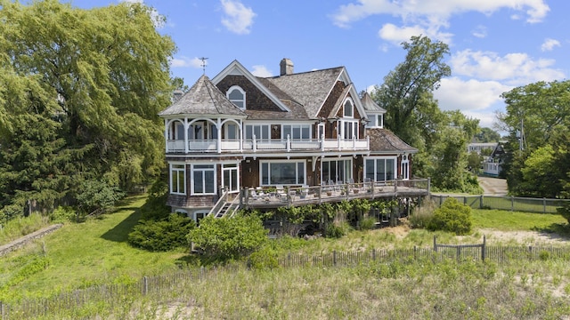 1410 S Pine Creek Rd, Fairfield, CT 06824 - rear view of house featuring a wooden deck, a balcony, and a chimney