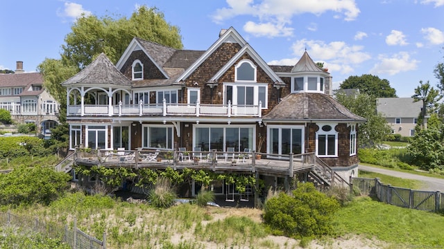 1410 S Pine Creek Rd, Fairfield, CT 06824 - rear view of house with a balcony, a fenced backyard, a deck, and stairway