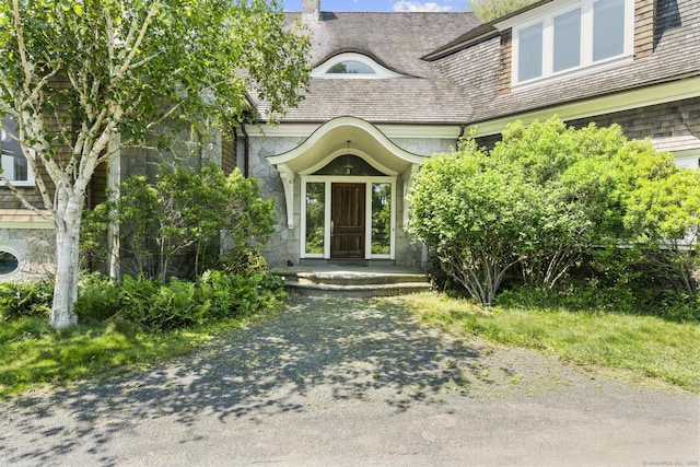 1410 S Pine Creek Rd, Fairfield, CT 06824 - property entrance featuring stone siding and a chimney