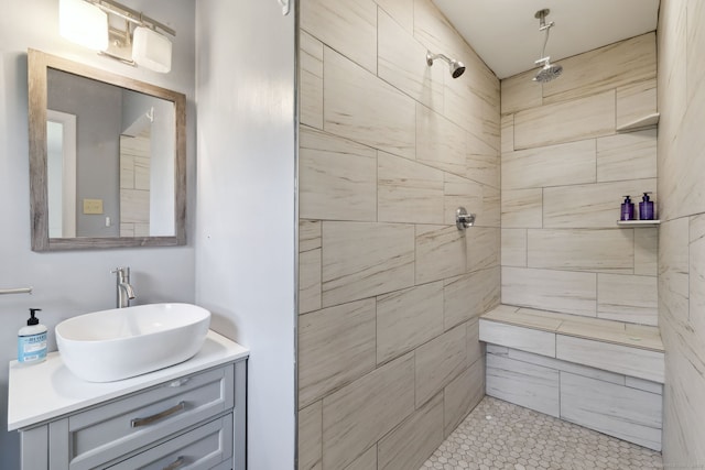 107 Carroll Rd, Hamden, CT 06517 - bathroom featuring a tile shower, vanity, and tile patterned flooring