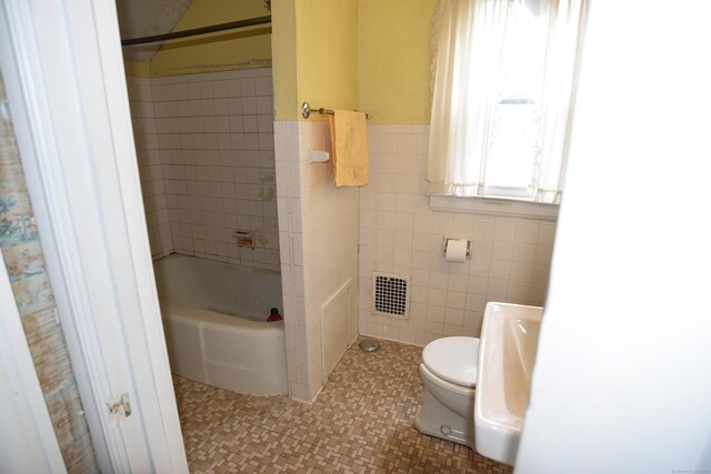 190 Victoria Rd, Hartford, CT 06114 - full bath with tile walls, shower / bathtub combination, and tile patterned floors