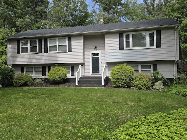77 Hartz Ln, East Hartford, CT 06118 - split foyer home featuring a front lawn and a chimney