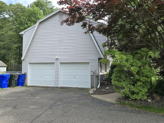 77 Hartz Ln, East Hartford, CT 06118 - view of home's exterior featuring driveway
