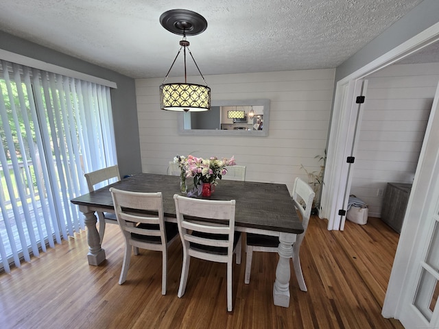 77 Hartz Ln, East Hartford, CT 06118 - dining area featuring wood finished floors and a textured ceiling