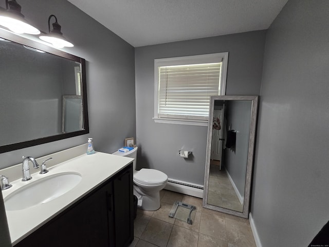 77 Hartz Ln, East Hartford, CT 06118 - bathroom featuring baseboard heating, vanity, and tile patterned floors