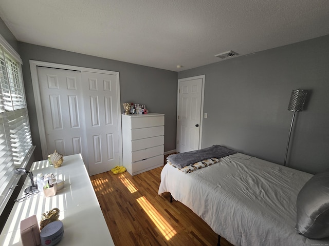 77 Hartz Ln, East Hartford, CT 06118 - bedroom with wood finished floors and a closet
