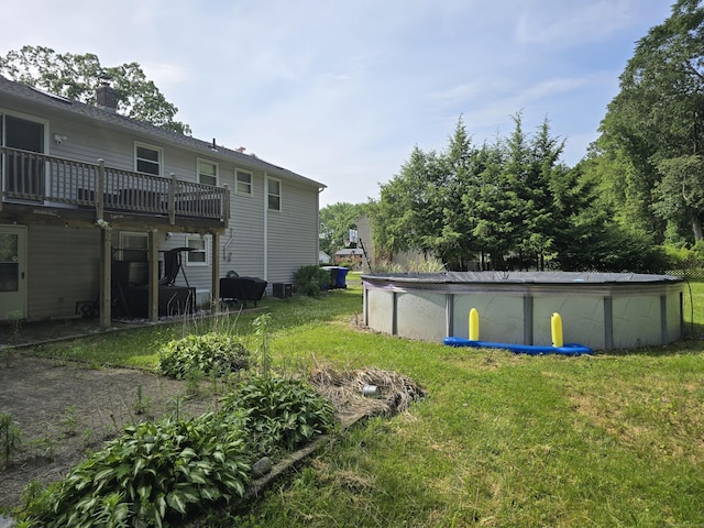 77 Hartz Ln, East Hartford, CT 06118 - view of grassy yard featuring a deck and an outdoor pool