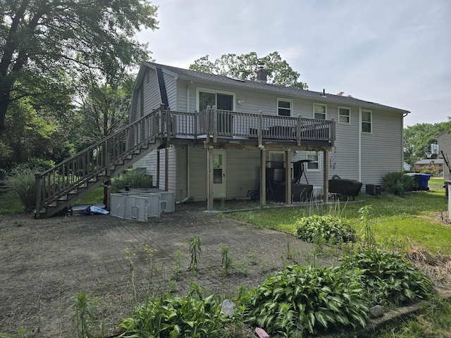 77 Hartz Ln, East Hartford, CT 06118 - rear view of property with stairway, a wooden deck, and a chimney