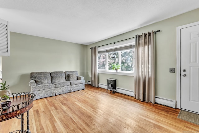 46 Jackson Rd, Enfield, CT 06082 - living area with wood finished floors and baseboard heating
