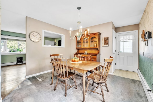 46 Jackson Rd, Enfield, CT 06082 - dining area featuring healthy amount of natural light, a chandelier, and baseboard heating