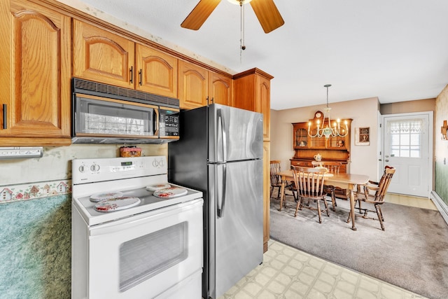 46 Jackson Rd, Enfield, CT 06082 - kitchen featuring electric stove, black microwave, freestanding refrigerator, a chandelier, and light floors