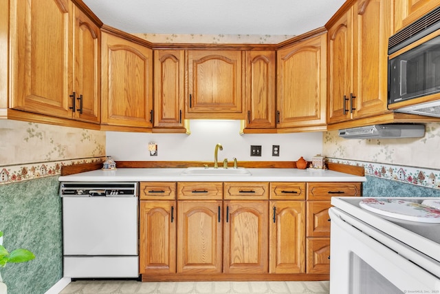 46 Jackson Rd, Enfield, CT 06082 - kitchen with white appliances, wallpapered walls, brown cabinets, and light countertops