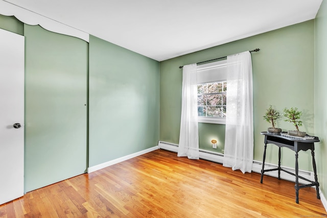 46 Jackson Rd, Enfield, CT 06082 - bedroom with wood finished floors and a baseboard radiator