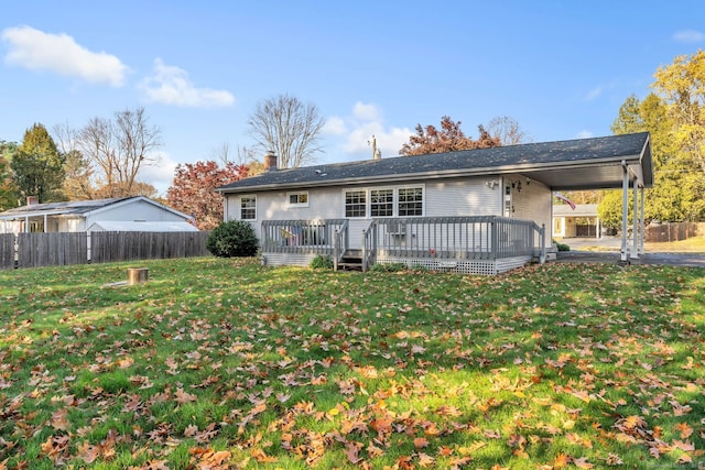46 Jackson Rd, Enfield, CT 06082 - back of house with an attached carport, a wooden deck, and a chimney