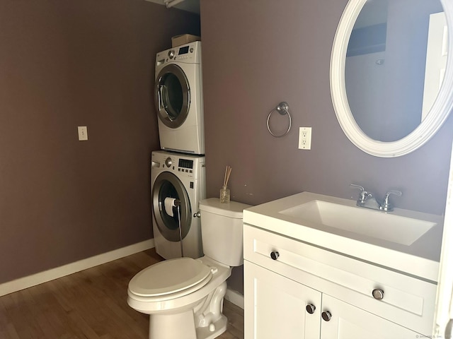 325 Lafayette St Unit 3303, Bridgeport, CT 06604 - bathroom with stacked washer and clothes dryer, wood finished floors, and vanity