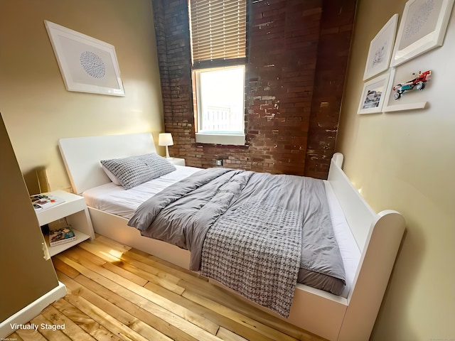 325 Lafayette St Unit 3303, Bridgeport, CT 06604 - bedroom with hardwood / wood-style floors and brick wall