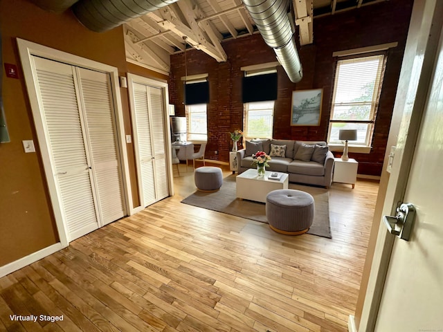 325 Lafayette St Unit 3303, Bridgeport, CT 06604 - living room featuring hardwood / wood-style floors, beam ceiling, and high vaulted ceiling