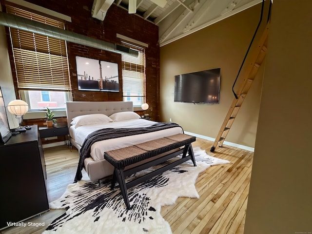 325 Lafayette St Unit 3303, Bridgeport, CT 06604 - bedroom featuring multiple windows, light wood-type flooring, beam ceiling, and high vaulted ceiling