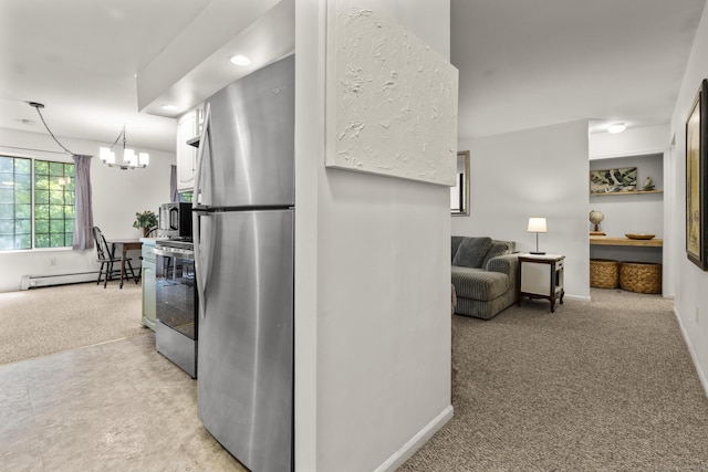 8 Carlisle Ct Unit 8, Brookfield, CT 06804 - kitchen featuring stainless steel appliances, a baseboard heating unit, light carpet, a chandelier, and white cabinets