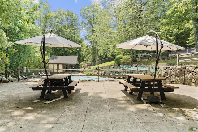 8 Carlisle Ct Unit 8, Brookfield, CT 06804 - view of home's community featuring an outbuilding, a swimming pool, a patio, and view of wooded area