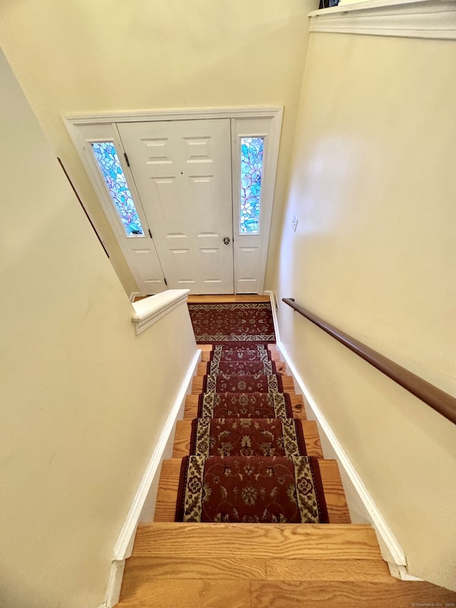 168 Cooper Ln, Hamden, CT 06514 - stairs featuring wood finished floors and plenty of natural light