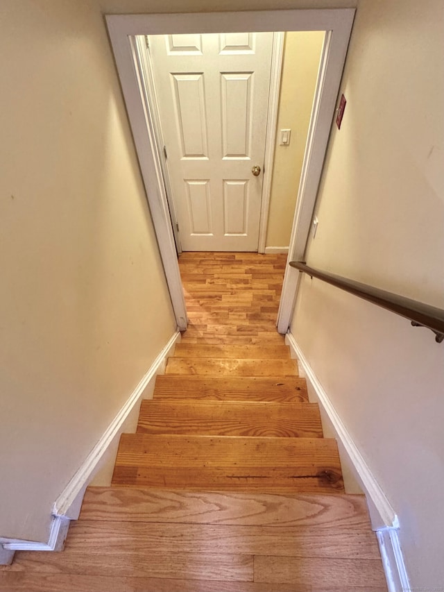 168 Cooper Ln, Hamden, CT 06514 - stairs featuring wood finished floors and baseboards