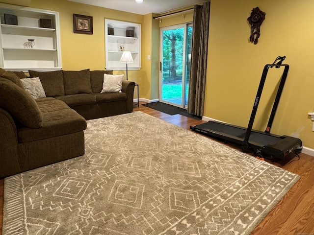 168 Cooper Ln, Hamden, CT 06514 - living room featuring wood finished floors and built in features